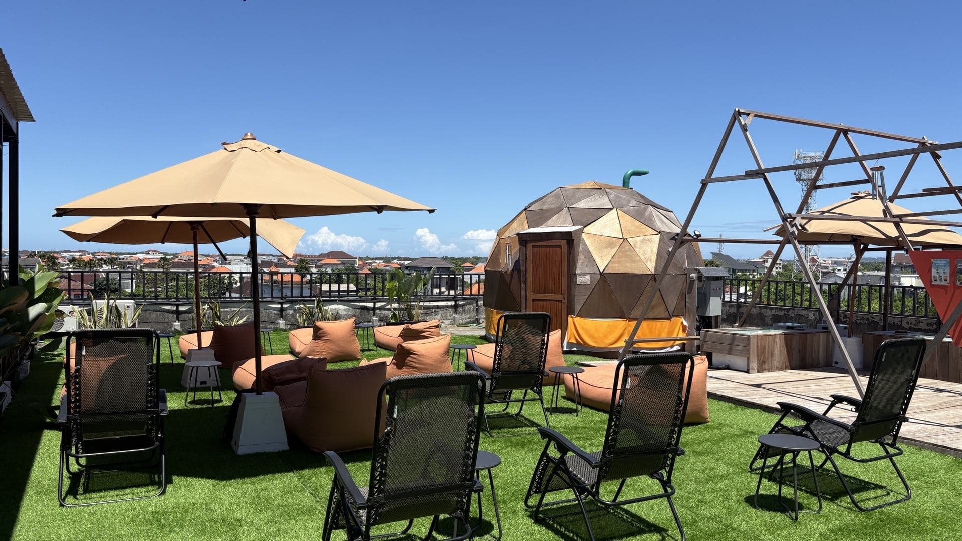 Rooftop with individual ice bath tubs beside the dome sauna